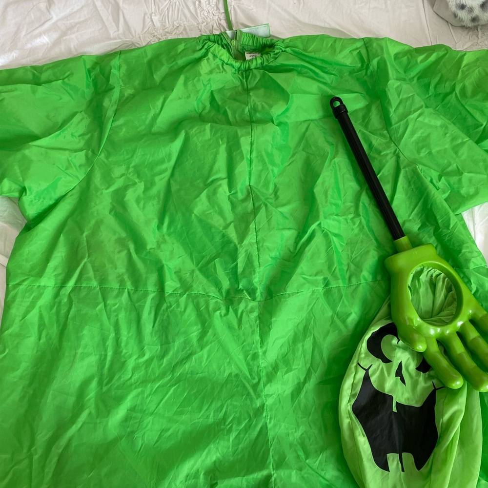 inflatable green costume and candy bag